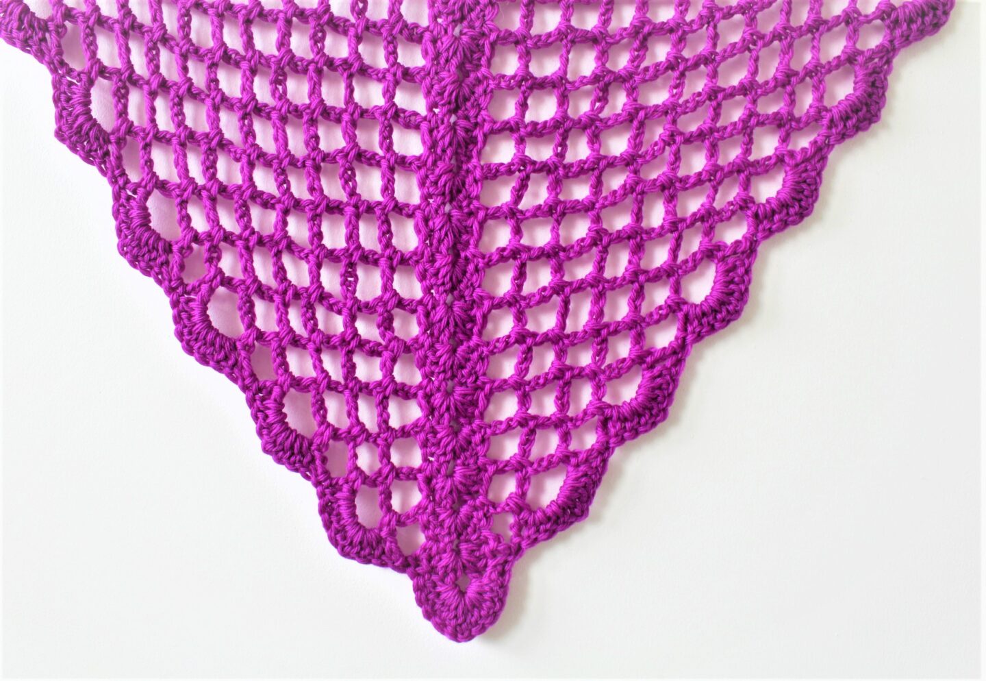 Close up of the Eleanor triangle shawl with a lovely shell stitch design